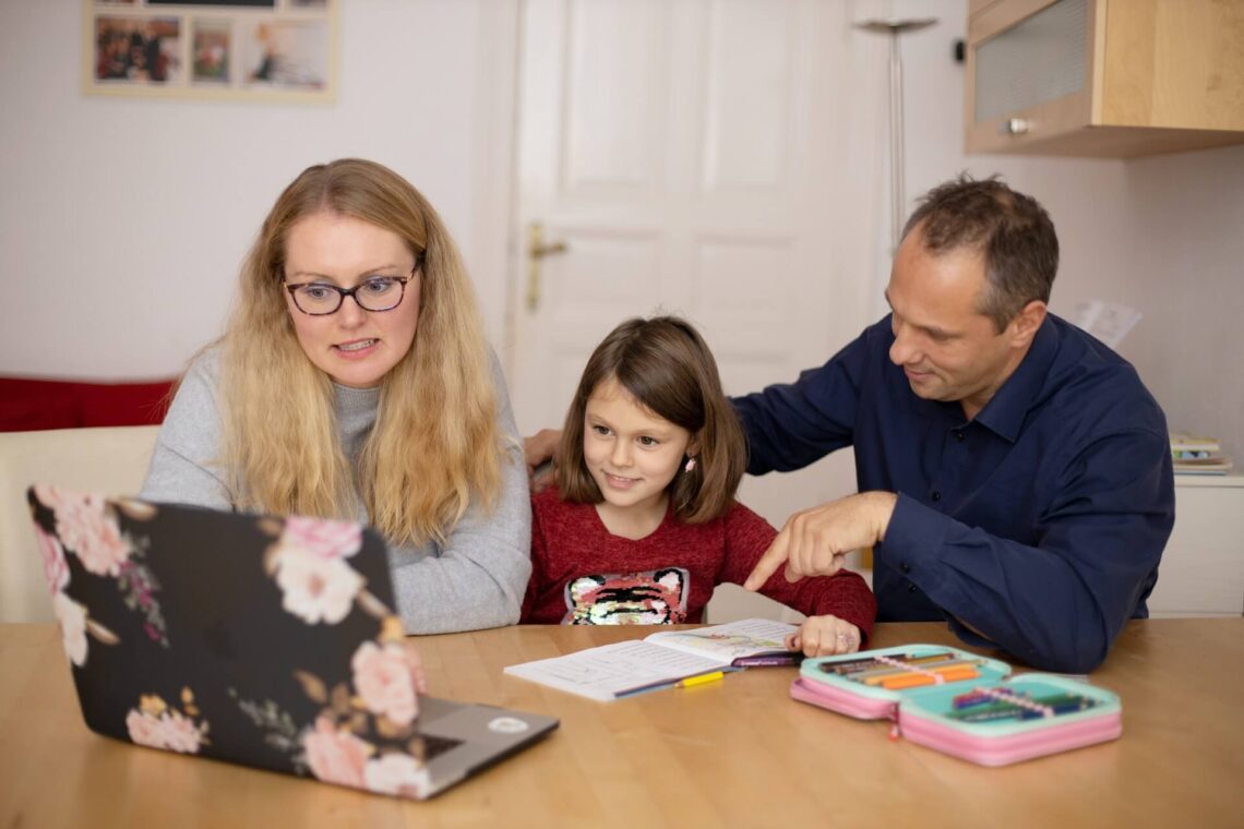 caregivers teaching a child in home school