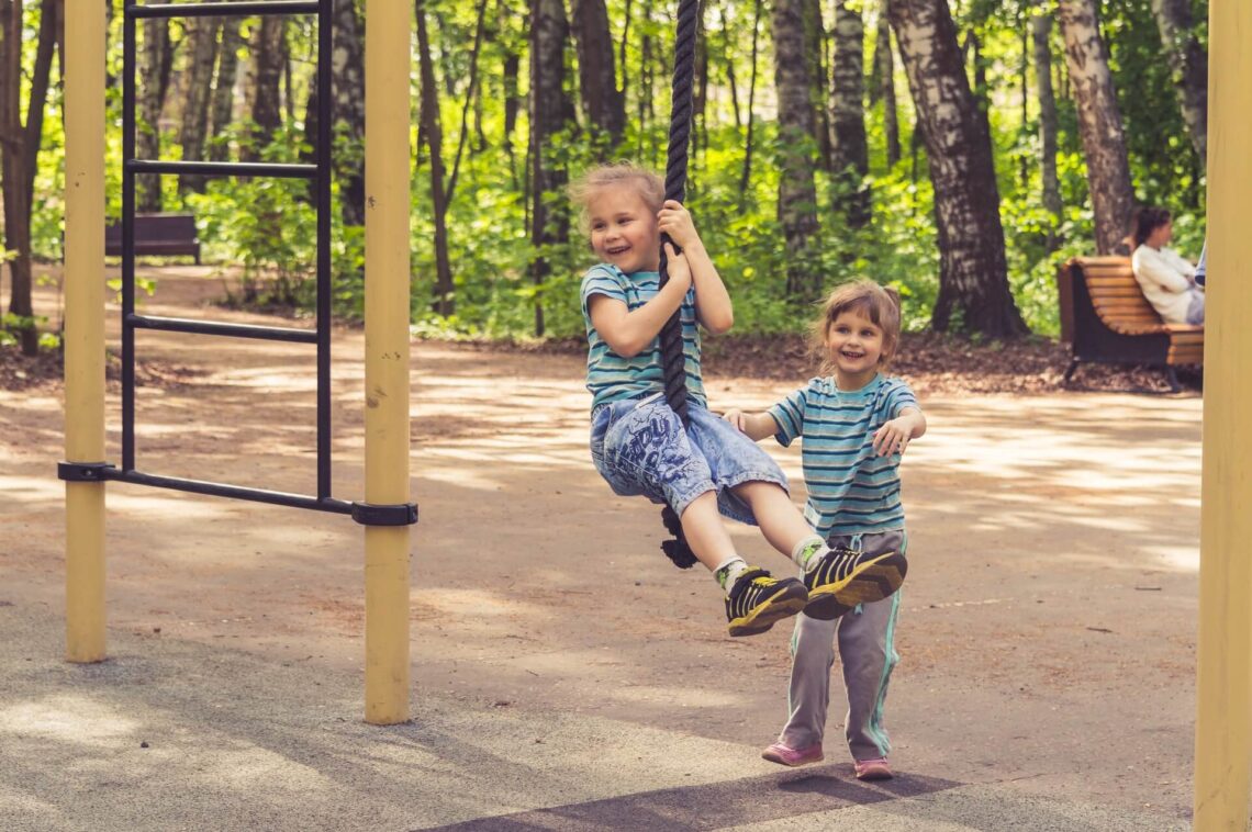 children playing on a swing