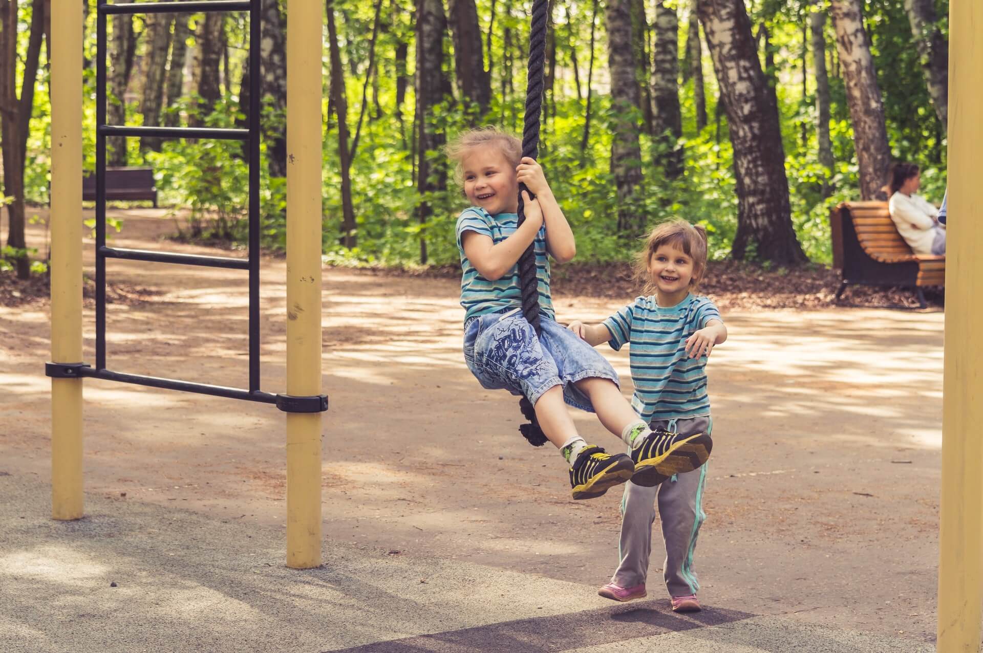 children playing on a swing
