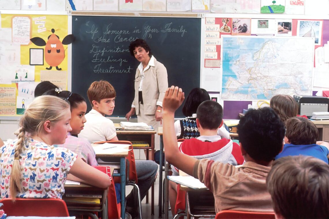a teacher giving lessons in class